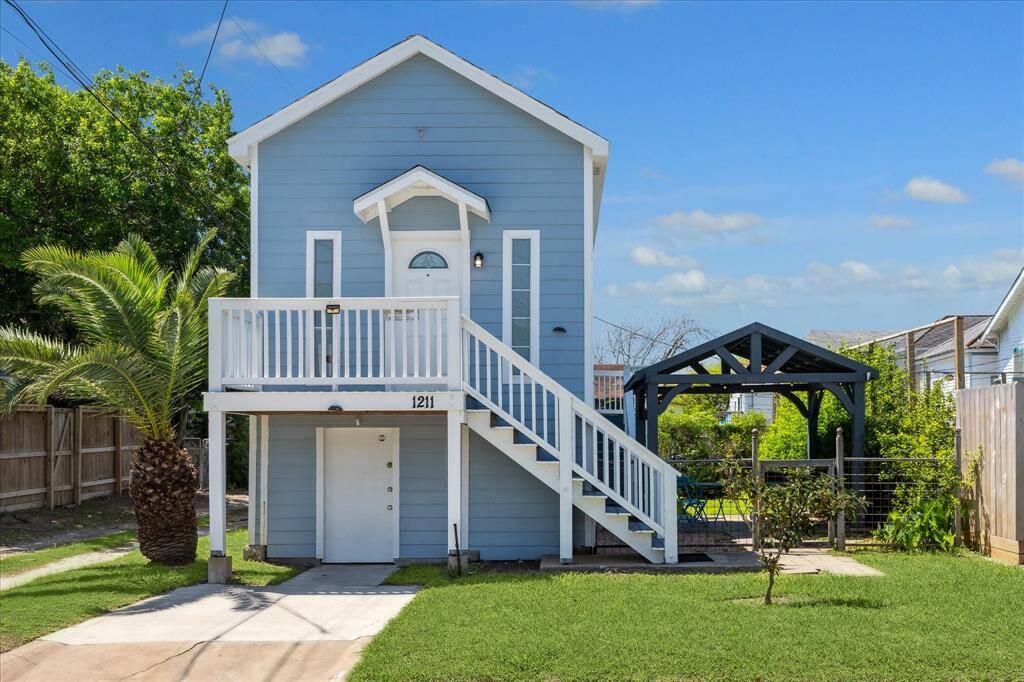 Welcome to 1211 12th St. First floor offers abundant storage or can be converted to a one small car or golf cart garage.