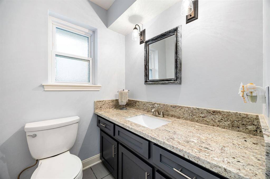 Half bath is located between the kitchen area and laundry room.