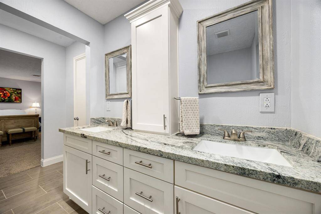 The vanity provides plenty of space for storage.