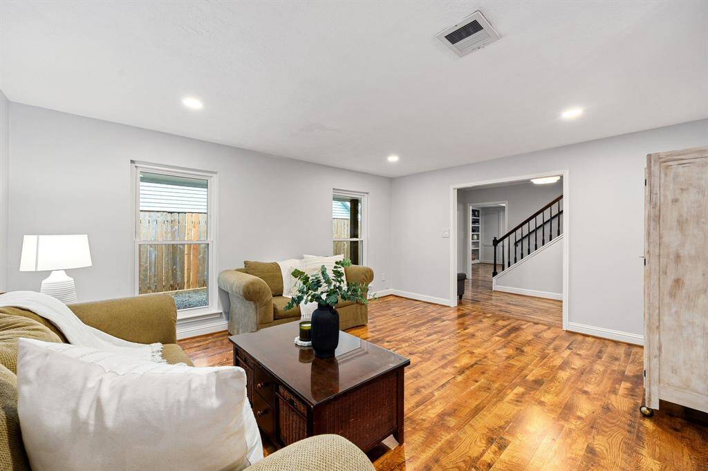 The formal living room provides a warm greeting as you step inside the home.