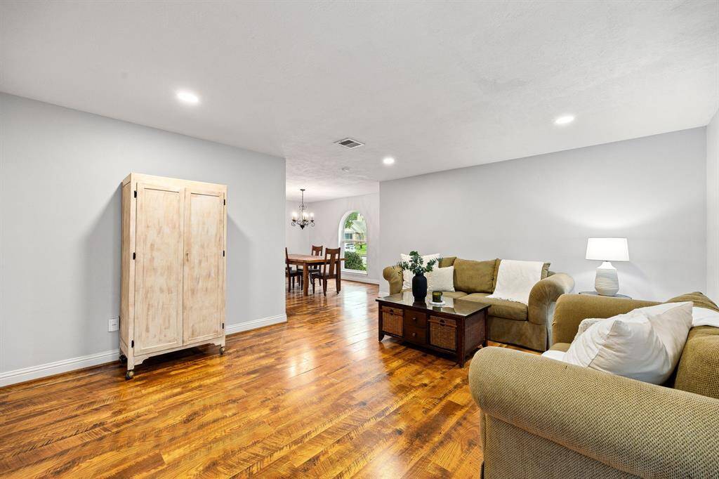 The formal living room seamlessly flows into the formal dining room making it perfect for hosting.