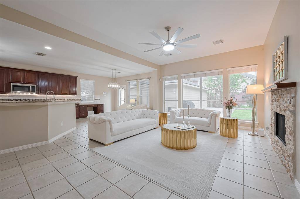 Ideal for entertaining, the kitchen smoothly transitions into the inviting living room.