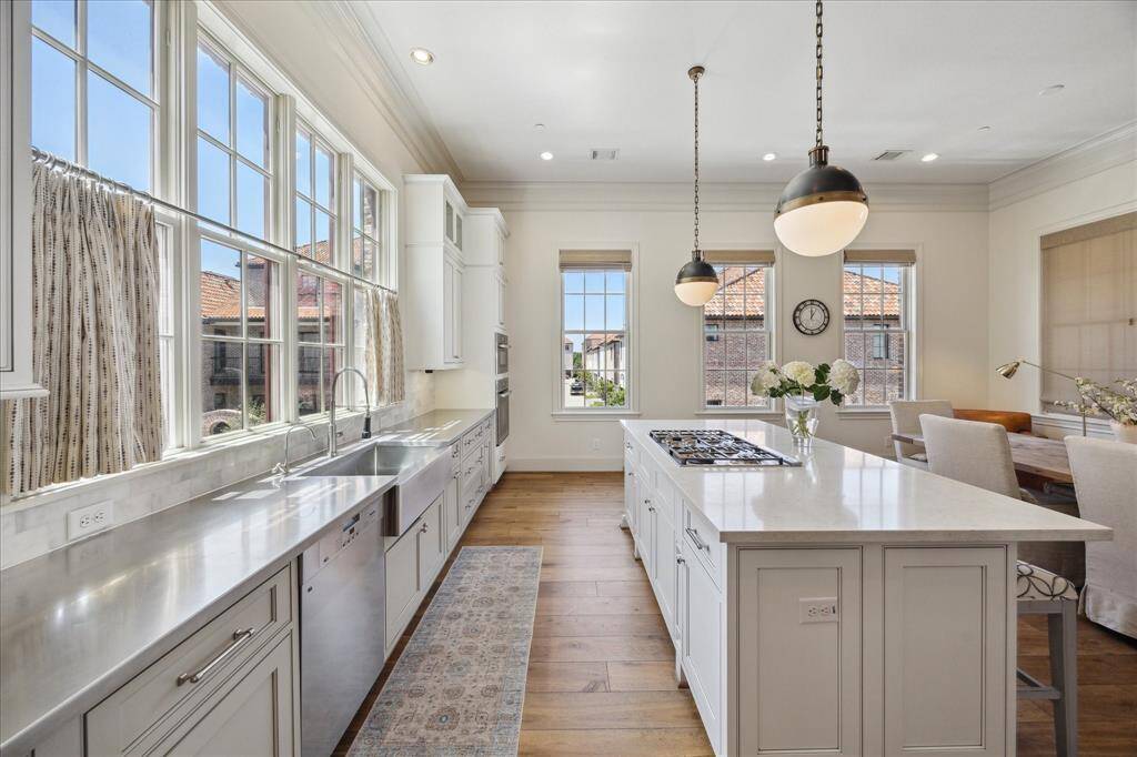 This area benefits from sunlight streaming in through its south- and west-facing windows, creating an inviting space for cooking and entertaining.