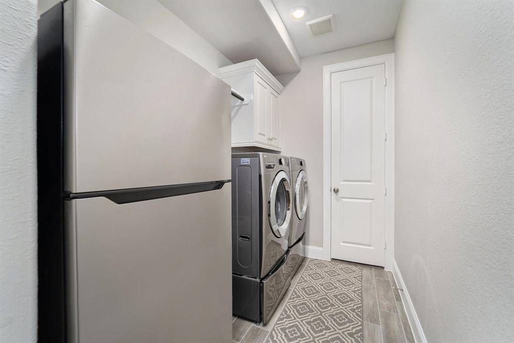 View of the laundry room that leads to the primary closet.
