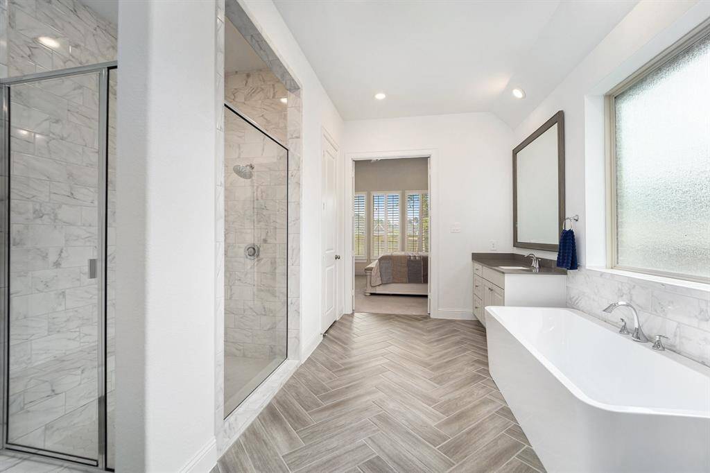 This primary bathroom also has a massive walk-in shower!