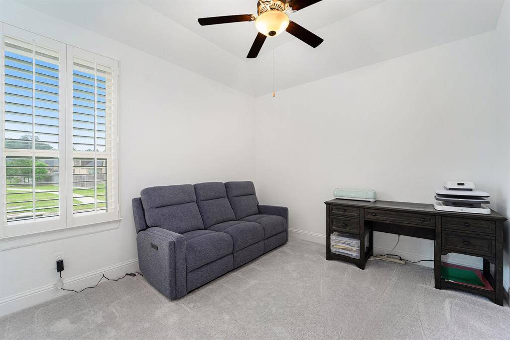 Secondary bedroom currently being used as an additional home office.