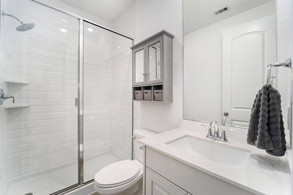 Another secondary bathroom with a glass-standing shower!