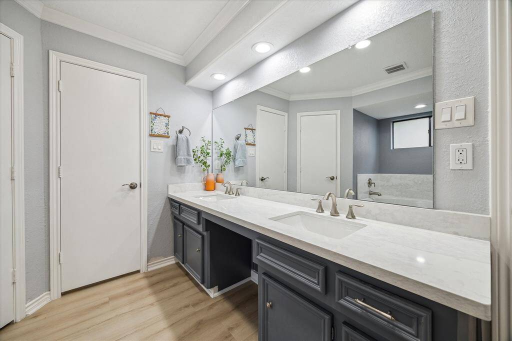 The primary ensuite bath has dual sinks, a private water closet, separate shower and soaking tub.  Recent upgrades include undermount sinks and brushed nickel faucets.