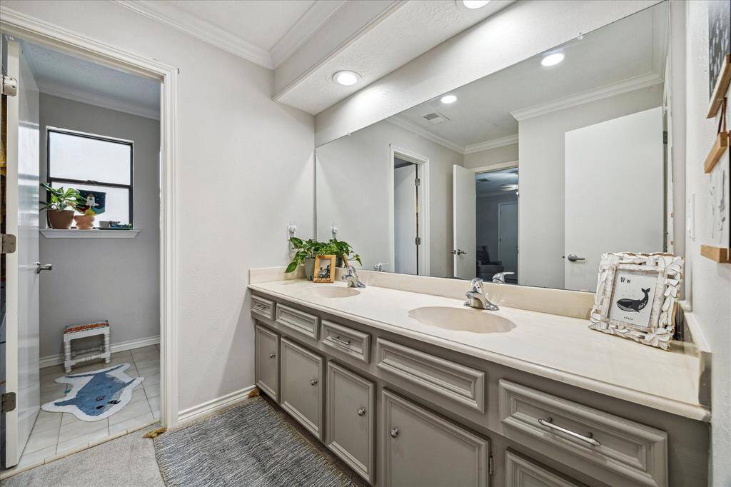 The second floor full bath enjoys dual sinks with a separate private space for the tub/shower and toilet; perfect for multiple family member's use.