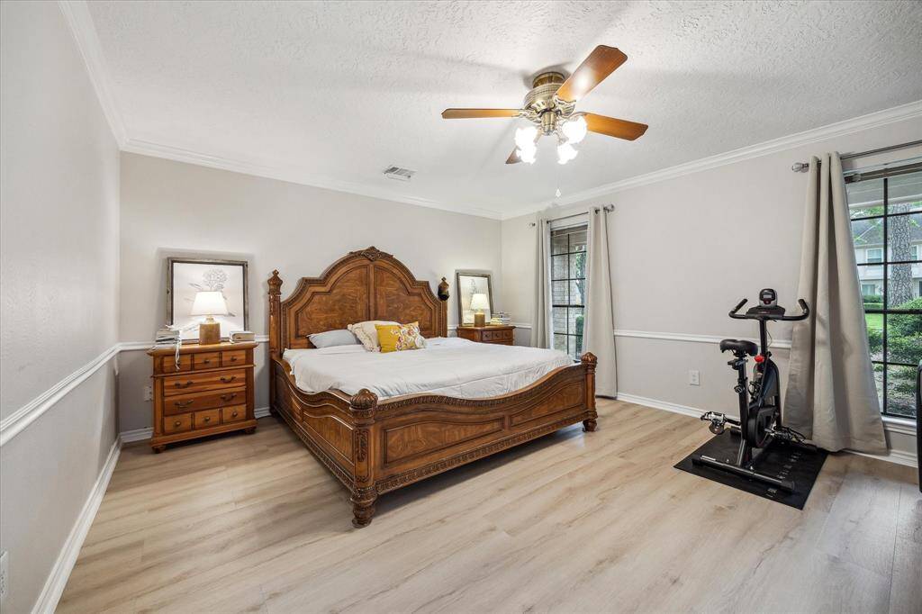 The generously sized primary bedroom suite is large enough to accommodate a sitting area or workout space/equipment.