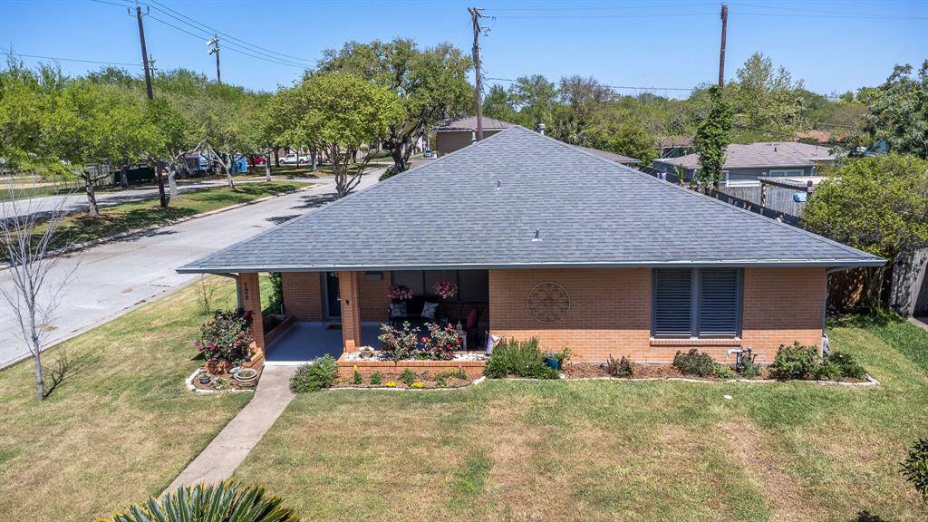 128 Dolphin, brick one story with Marine Drive and Lindale Park to the left. Off street parking and 2 car garage on the left side of the house.