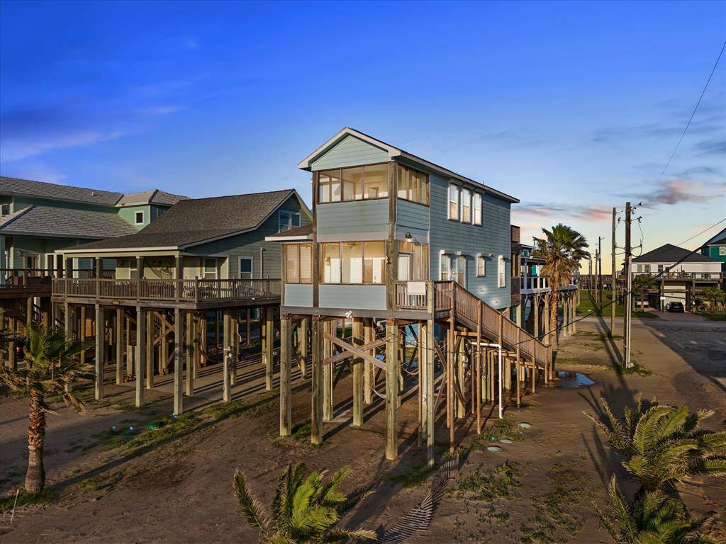 Elevated beachfront home with scenic ocean views, featuring a spacious deck and modern design. Ideal for enjoying coastal living.