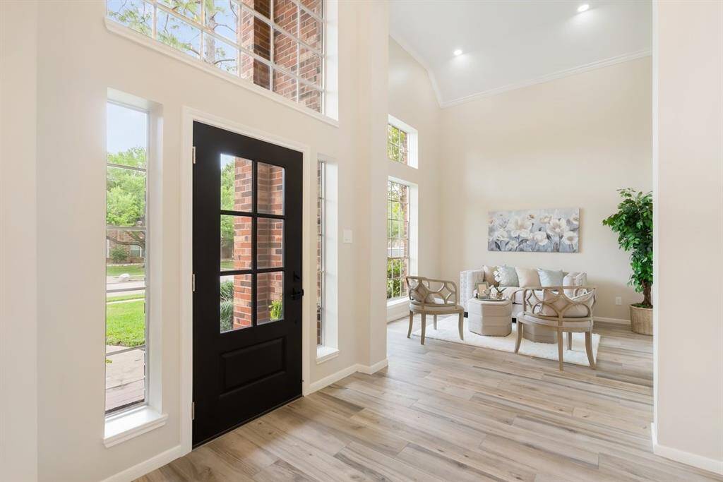 Graceful wood look tile flows throughout the first floor!