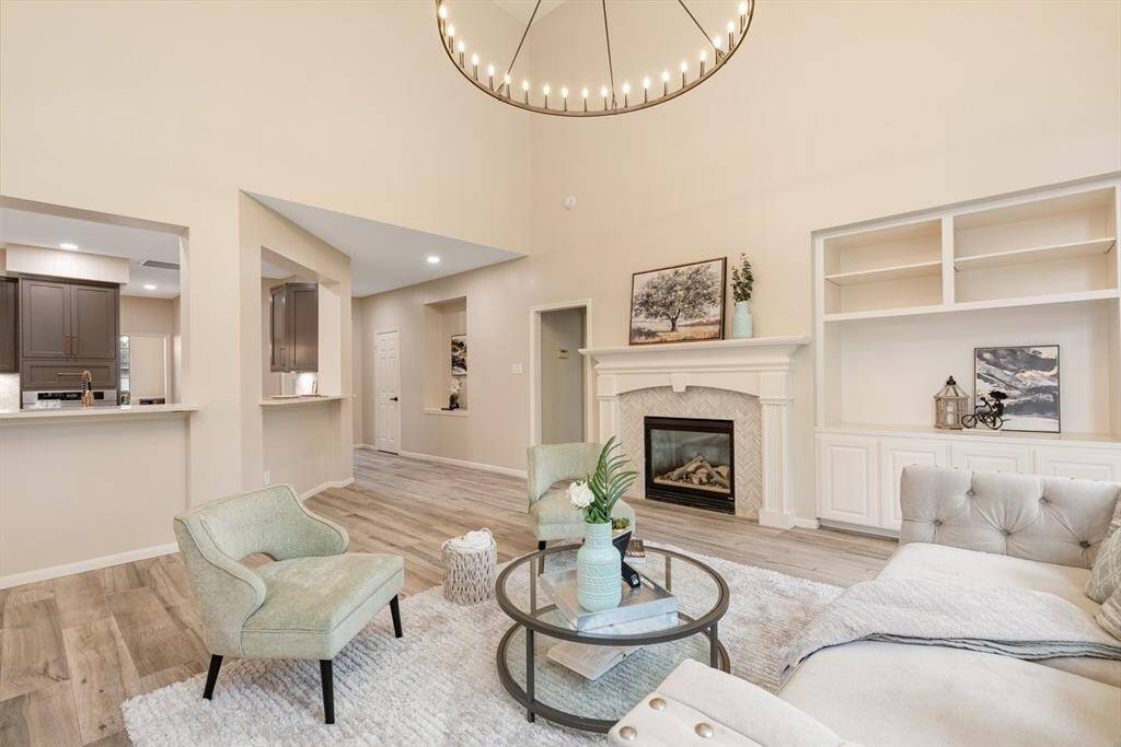 High ceilings, built in storage and stunning fireplace tile are highlights of this great space!