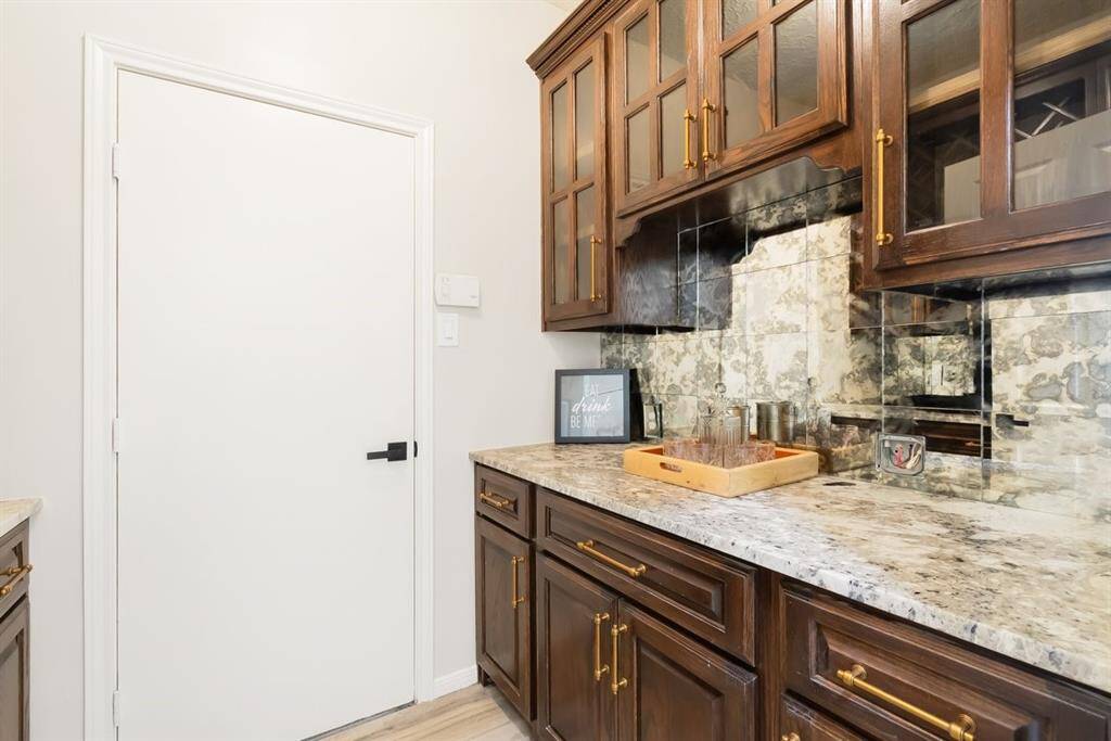 Enjoy even more storage with a butler's pantry and bar-directly behind the kitchen!