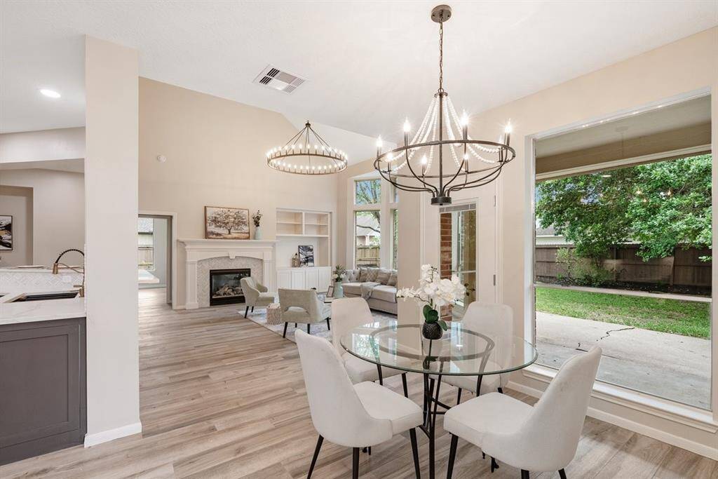Mornings are fun and relaxing in this breakfast nook equipped with a gorgeous chandelier!