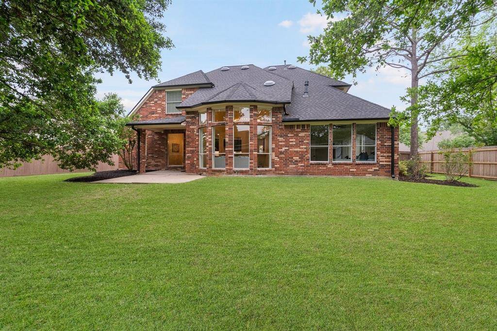 This spacious backyard has plenty of room to run around with furry friends!