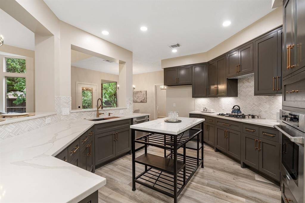 Prep your gourmet meals while you admire beautiful finishes in the kitchen! NEW cabinets, appliances and quartz counters are not only beautiful, but provide great space for cooking!
