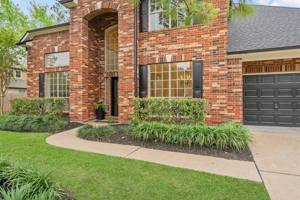 A path leads you past beautiful landscaping, straight to your front door!
