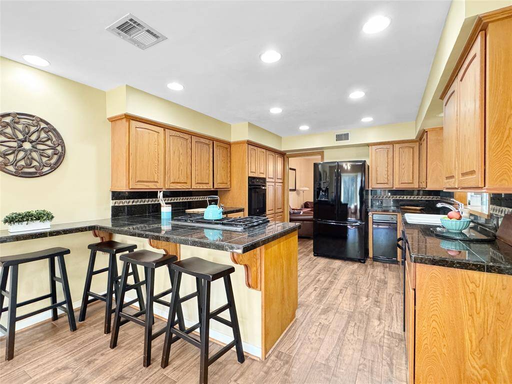 Great size kitchen with breakfast bar.
