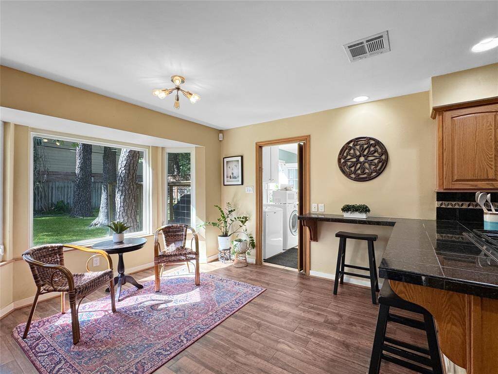 Breakfast area adjacent to the kitchen, overlooking the lush back yard!