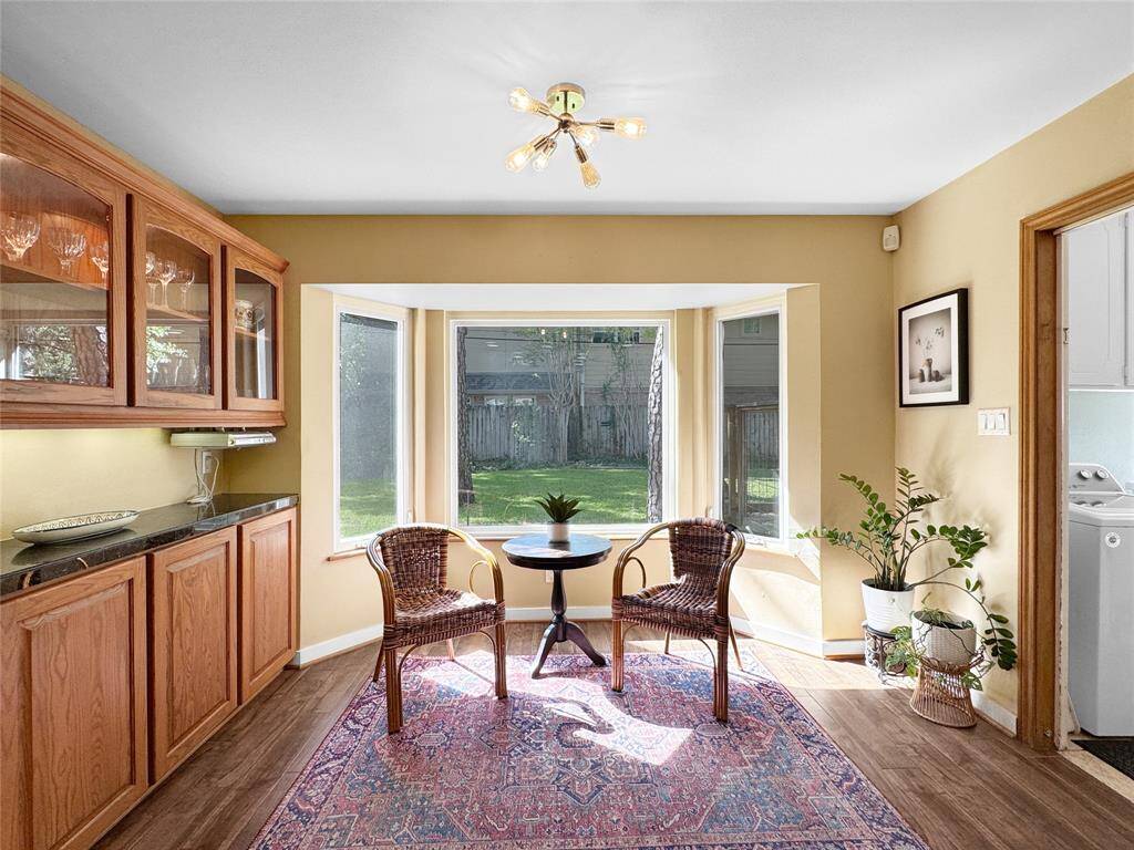 Breakfast area adjacent to the kitchen, overlooking the lush back yard!