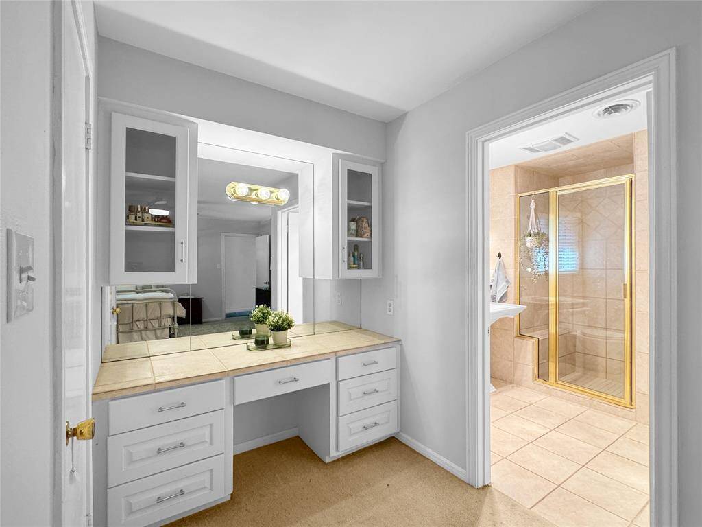 Vanity area inside primary bedroom.