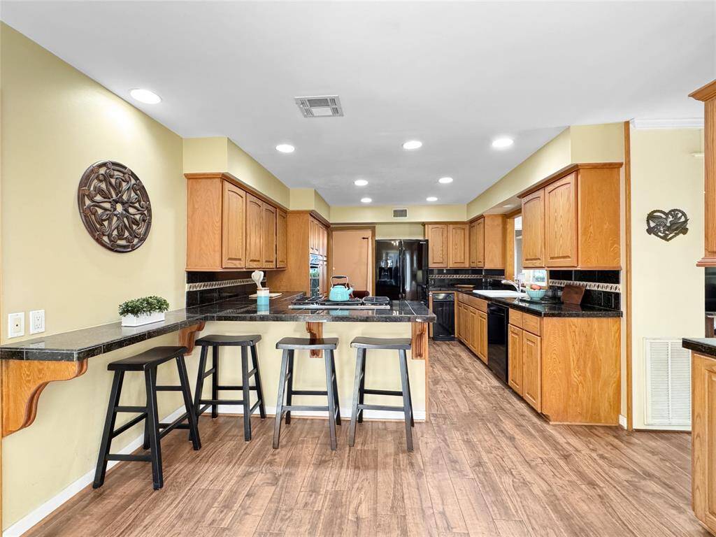 Great size kitchen with breakfast bar.