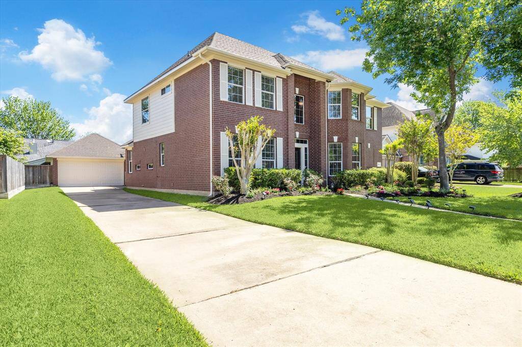 STATELY TWO STORY BRICK HOME IN THE HEART OF GREATWOOD BROOKS MILL.
