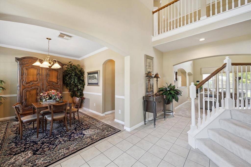 FORMAL DINING IS TO THE LEFT OF THE ENTRY AND JUST OFF THE KITCHEN FOR ADDED CONVENIENCE.
