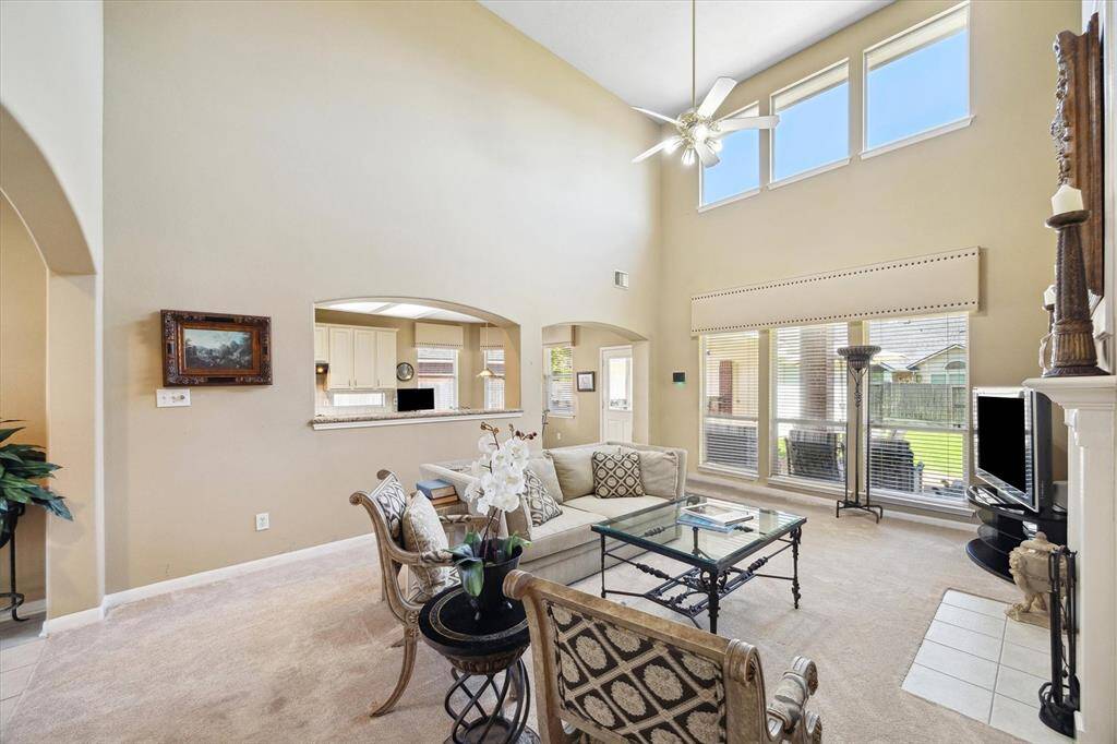 SOARING TWO STORY CEILINGS WITH TRANSOM WINDOWS ALLOW FOR PLENTY OF NATURAL LIGHT.