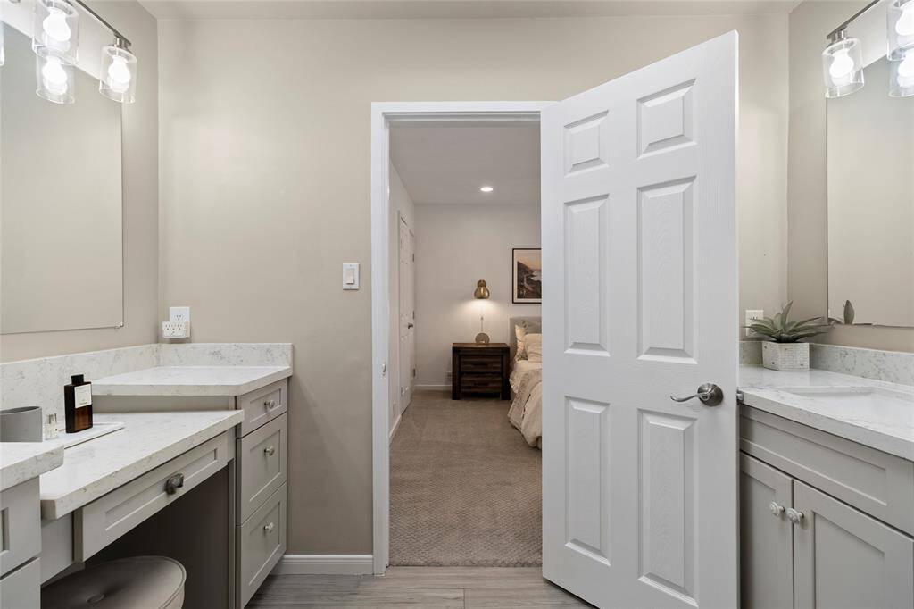 Opposite frame of the primary bathroom showcasing the incredible vanity spaces.