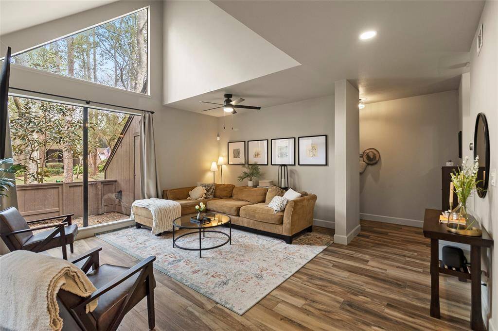 Another angle of the living room highlighting the lovely natural light and valued ceilings.