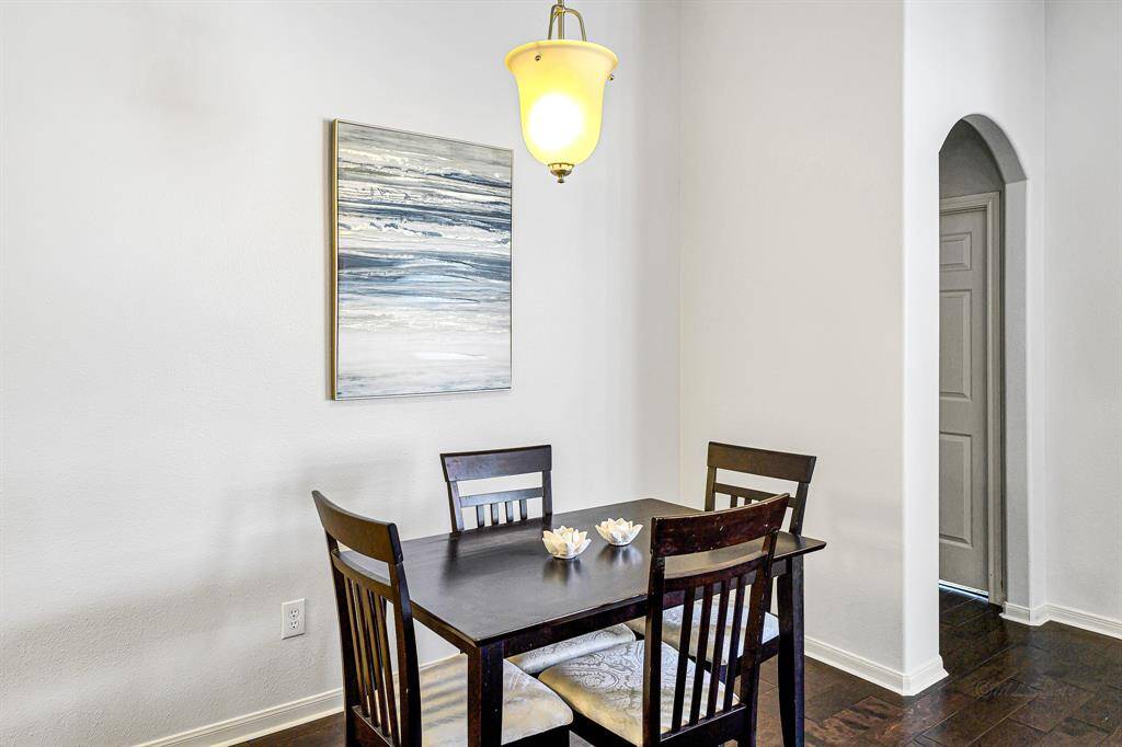 Just beyond the kitchen, the breakfast area offers a cozy yet stylish space to start your day.