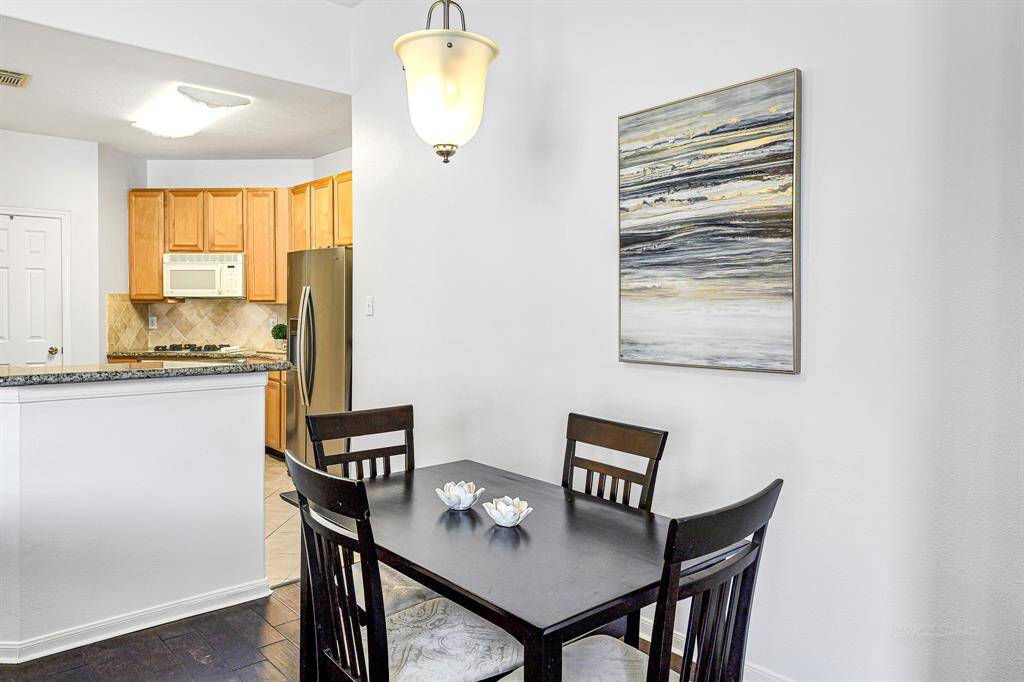 Featuring 5-inch plank engineered hardwood floors, fresh interior paint, and a brushed nickel pendant light, thisarea exudes warmth and charm.