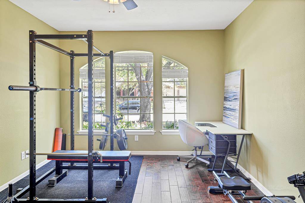 This study is adorned with 9-foot ceilings and 5-inch engineered wood planks. Double doors open to reveal an airy space filled with natural light from three brightwindows, each featuring elegant arches and look out to your front yard.