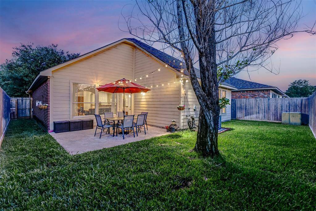 The patio offers ample space for a large outdoor furniture set or your favorite grill, making it an ideal spot for relaxing and entertaining. Other outdoor features includedurable HardiPlank siding, gutters for added convenience, a poured patio perfect for outdoor gatherings, mature trees offering shade and privacy, and lush landscaping.