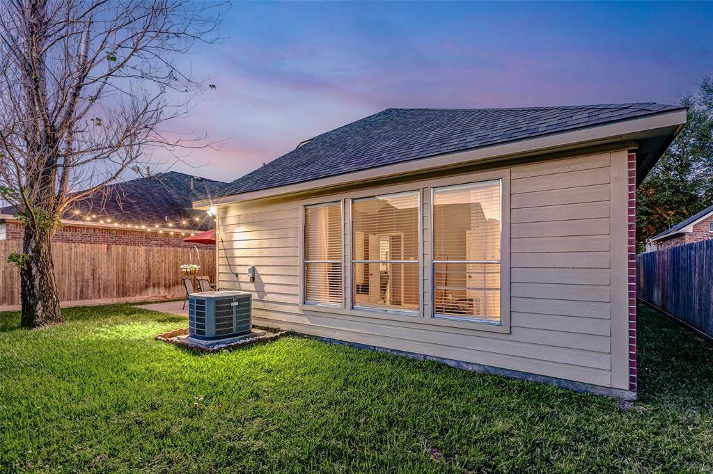 The cedar fence was recently replaced in 2024, providing bothprivacy and a fresh, updated look to the backyard. Notice how, even with the expansive patio, there is still anabundance of green space perfect for family play, pets to roam, or a garden to thrive —offering endless possibilities foroutdoor enjoyment.
