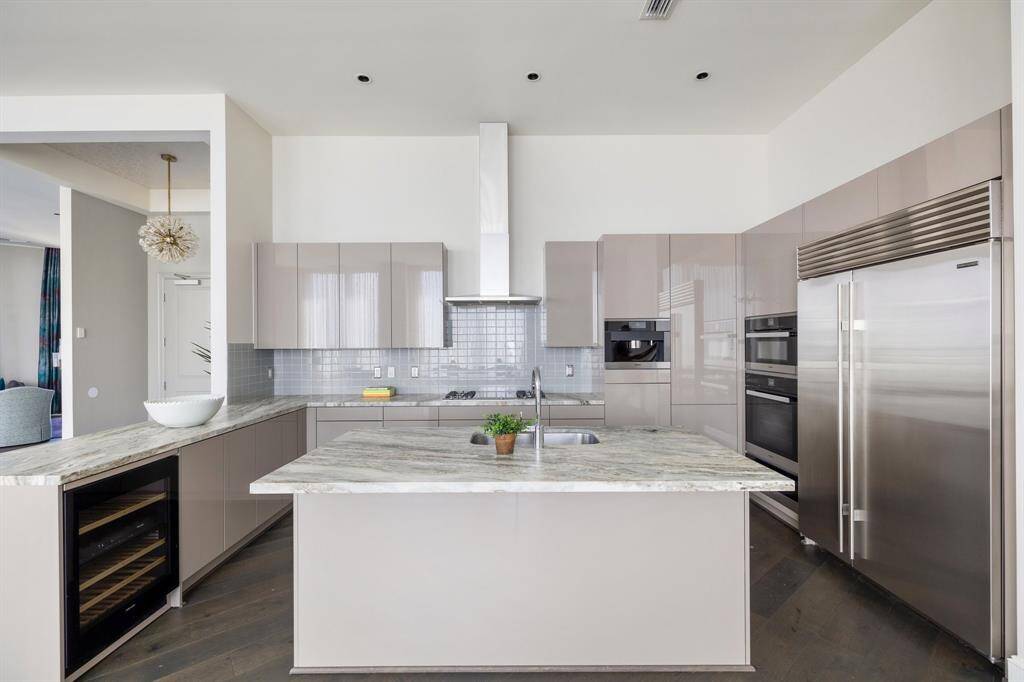 Marble countertops and both gas and induction cooktop.