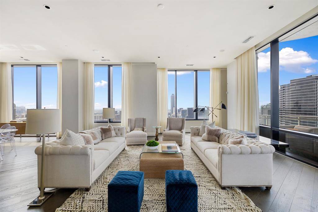 Walls of windows, adorned with automatic drapes allow for gorgeous Galleria views.