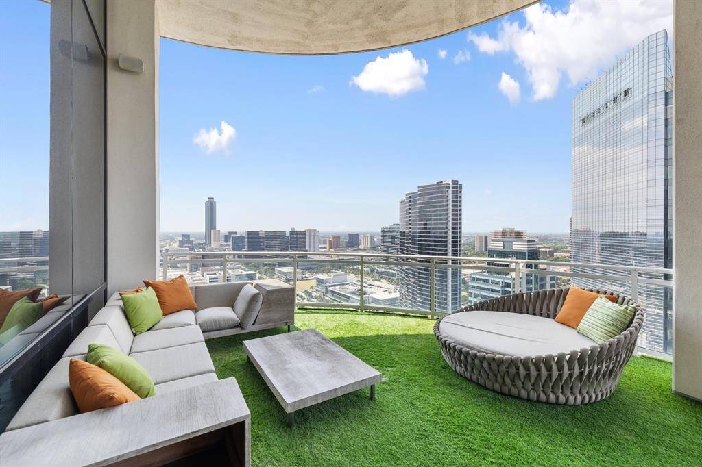 The turfed balcony with incredible panoramic views is the perfect outdoor entertaining space.