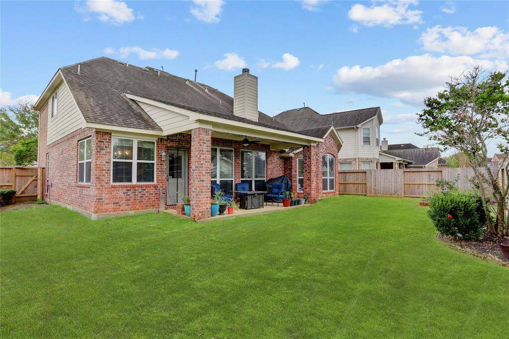 A SPACIOUS OUTDOORRETREAT PERFECT FORRELAXATION, SURROUNDEDBY A BEAUTIFULLYLANDSCAPED LAWN