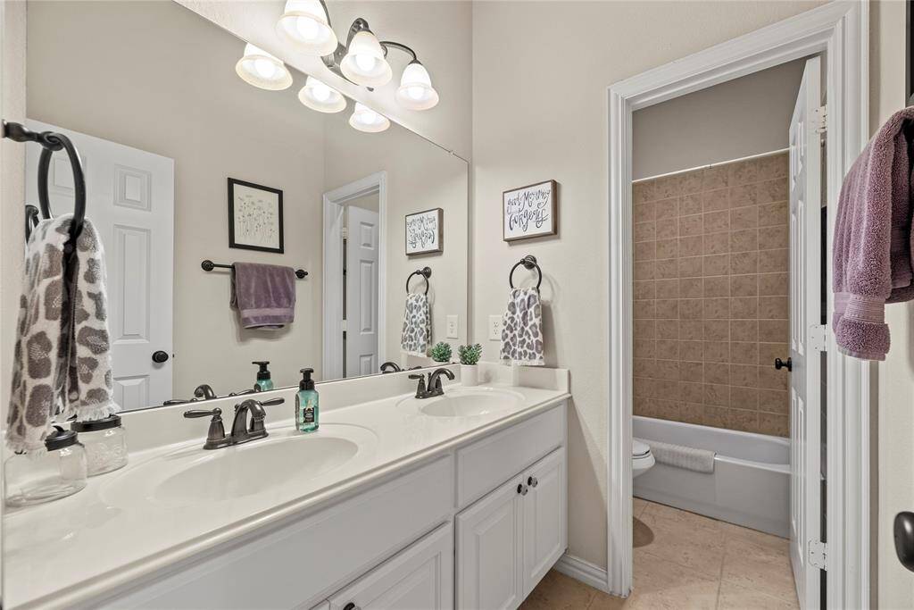 The generously sized secondary bath provides plenty of space, seamlessly blending comfort and functionality for a refreshing and relaxing retreat.