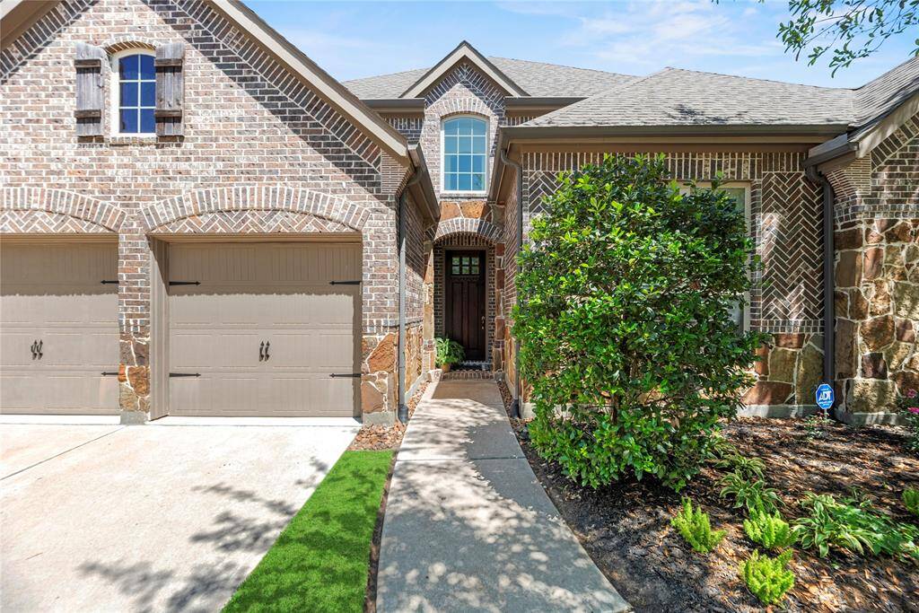The stone and brick exterior exudes charm and elegance, creating exceptional street appeal that captivates at first glance.