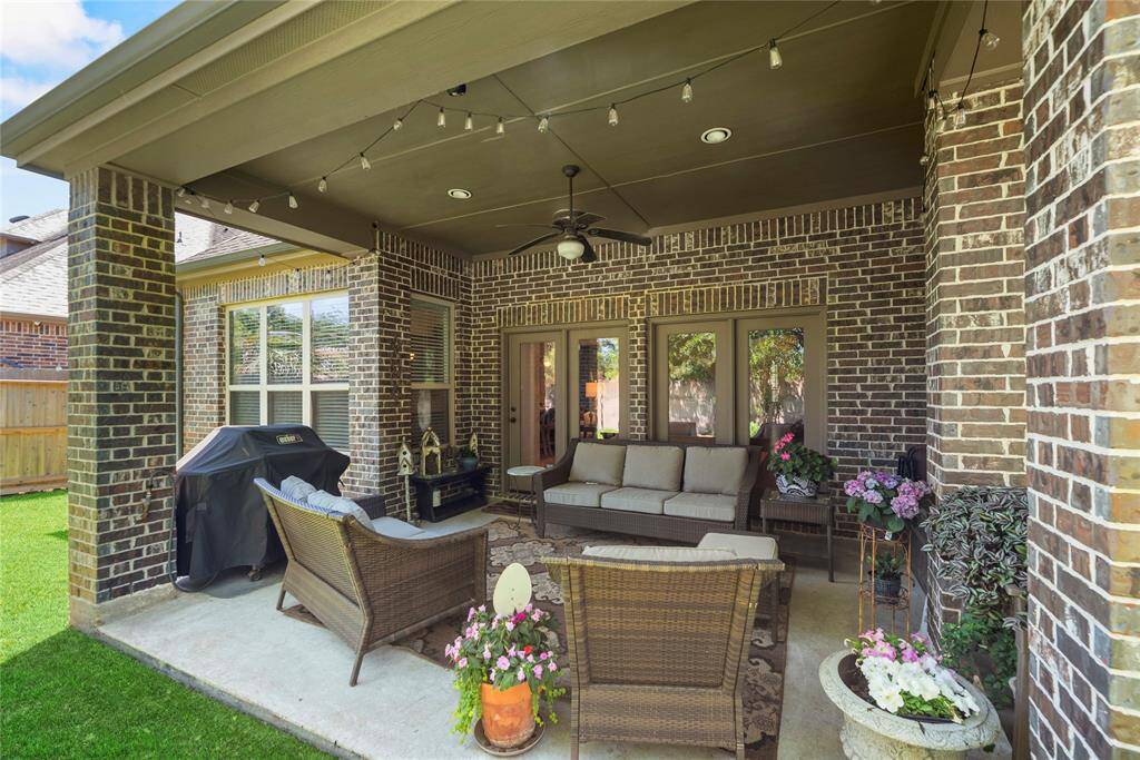 The covered patio is an easy place to sit back and watch the sunset or just get some "you time" in the fresh air.
