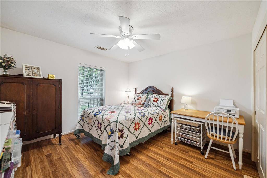 Front Secondary bedroom has pretty views of the front yard and a nice sized closet.
