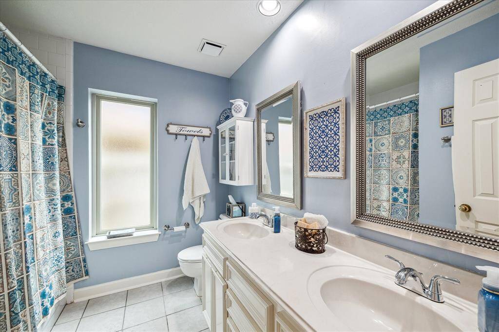Guest Bathroom is squeaky clean and even features double sinks!