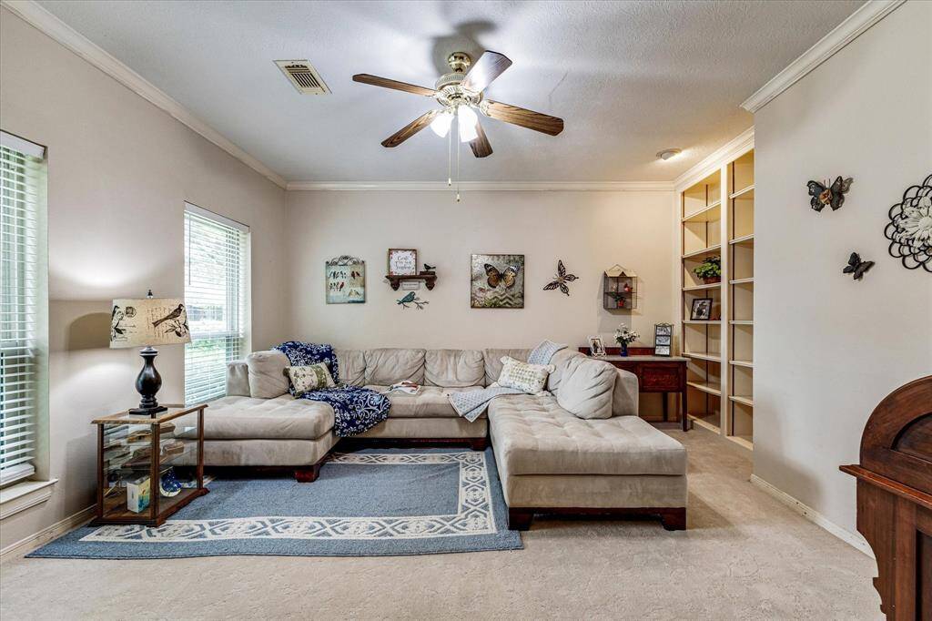 This room has great natural light and built in bookshelves