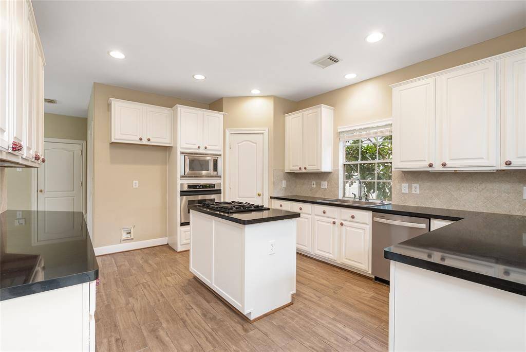 The cabinets, counters, and walk-in pantry have an abundance of space! Premium SS appliances!