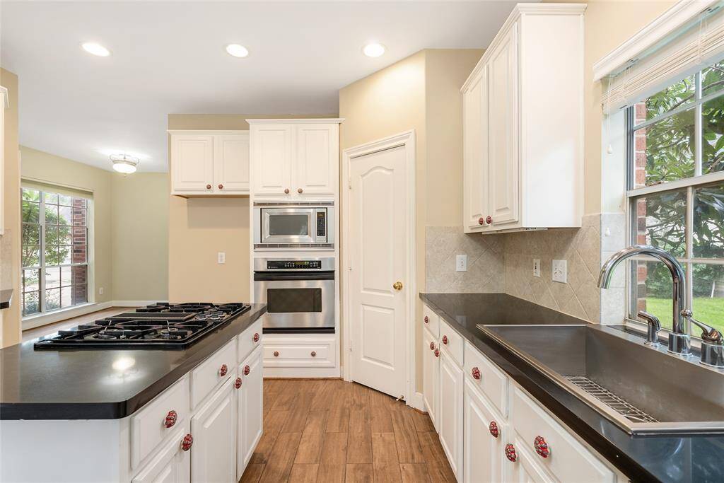 The depth and width of the kitchen sink, which overlooks a kumquat tree, makes this space a joy.